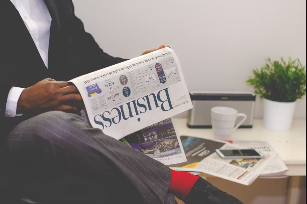 person holding a magazine